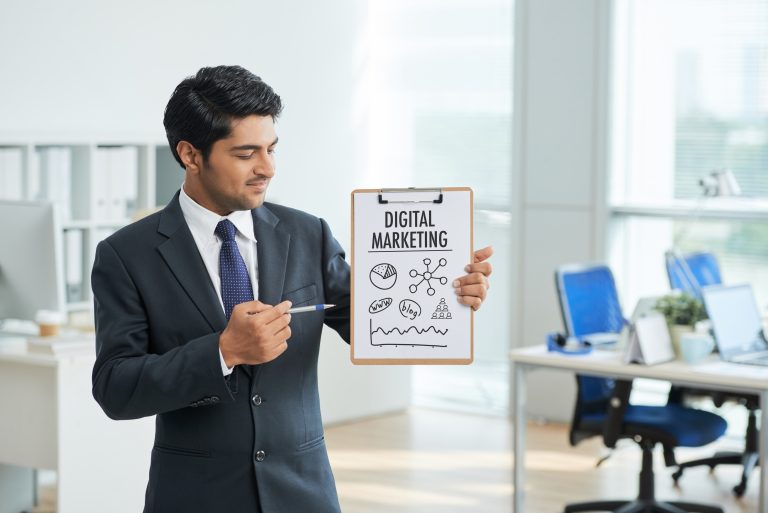 man suit standing office with clipboard-pointing-poster with words scaled